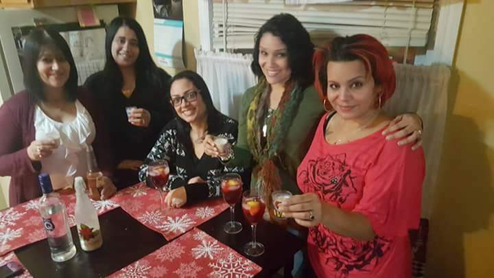 Friends gathered together in a warm moment from Layssa's life